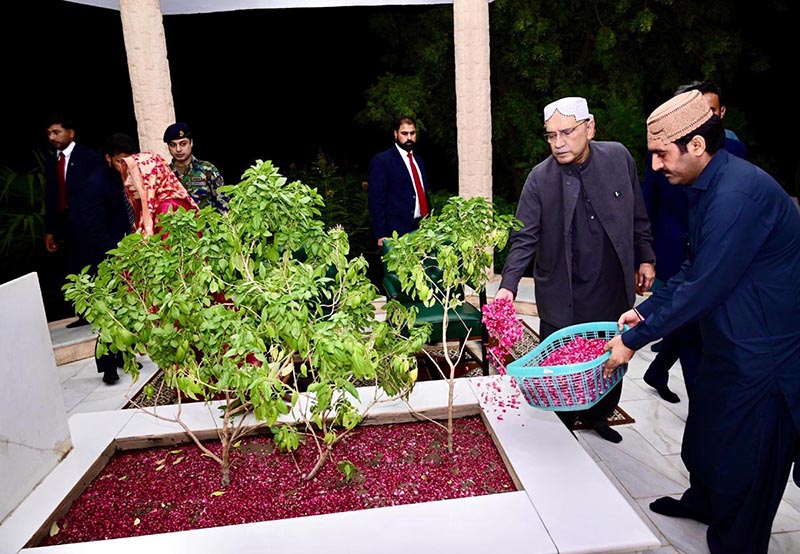 President Asif Ali Zardari offered Fateha and laid flowers on the grave of his father, Sardar Hakim Ali Zardari, at Baloo Ja Quba accompanied by his sister Fauzia Iqbal