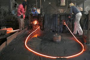 Labourers work at an iron factory in an industrial area as International Workers' Day is observed worldwide, commemorating the 1886 Chicago workers’ movement for labour rights. In Pakistan, May 1 was declared a public holiday following the country’s first labour policy introduced in 1972