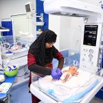 Nursing staff attend to newborn babies in incubators while performing duties on World Nursing Day at Sindh Institute of Child Health and Neonatology (SICHN) Children Hospital