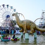 Children enjoy boat ridding and electrical swing on the second day of Eidul Azha at Funland in Rani Bagh