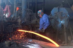 Labourers work at an iron factory in an industrial area as International Workers' Day is observed worldwide, commemorating the 1886 Chicago workers’ movement for labour rights. In Pakistan, May 1 was declared a public holiday following the country’s first labour policy introduced in 1972