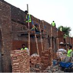 Workers are busy renovating and enhancing the wall along the railway station track, adding to the area’s overall appearance