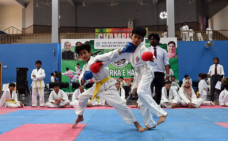 Players are in action during a karate competition held in connection with marking the completion of one year of the victory of Marka-e-Haq Bunyan-ul-Marsoos. organized by District Sports department at Sports Gymnasium