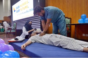 Nursing staff attend to newborn babies in incubators while performing duties on World Nursing Day at Sindh Institute of Child Health and Neonatology (SICHN) Children Hospital