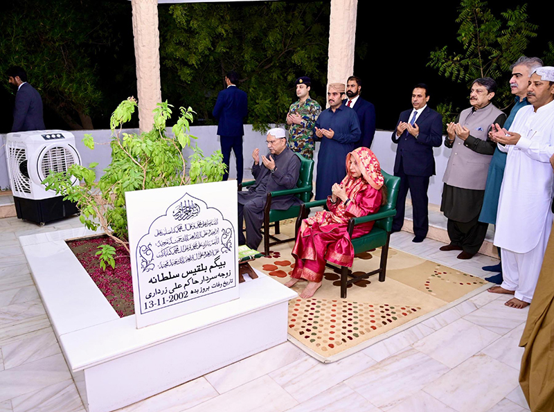 President Asif Ali Zardari offering Fateha and laying flowers on the grave of his mother, Begum Bilqees Sultana, at Baloo Ja Quba accompanied by his sister Fauzia Iqbal