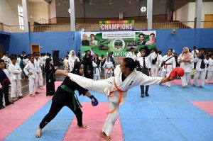 Players are in action during a karate competition held in connection with marking the completion of one year of the victory of Marka-e-Haq Bunyan-ul-Marsoos. organized by District Sports department at Sports Gymnasium
