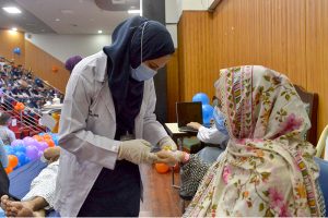 Nursing staff attend to newborn babies in incubators while performing duties on World Nursing Day at Sindh Institute of Child Health and Neonatology (SICHN) Children Hospital