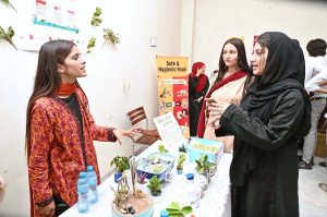 Students are visiting different stalls during an exhibition on Development Communication at University of Sargodha.
