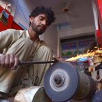 Blacksmith sharpen knives ahead of the Eid al-Adha