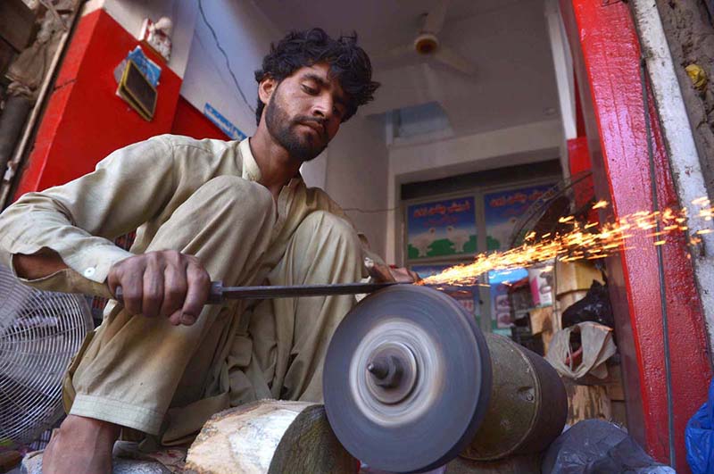 Blacksmith sharpen knives ahead of the Eid al-Adha