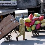 A worker pulls a trolley on the occasion of International Workers' Day