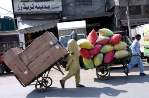 A worker pulls a trolley on the occasion of International Workers' Day