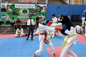Players are in action during a karate competition held in connection with marking the completion of one year of the victory of Marka-e-Haq Bunyan-ul-Marsoos. organized by District Sports department at Sports Gymnasium