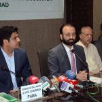 President Faisalabad Chamber of Commerce & Industry (FCCI) Farooq Yousaf Sheikh is addressing a press conference at PHMA Office