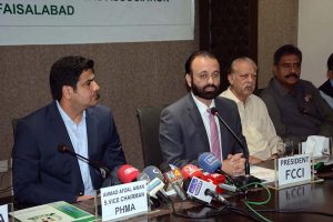 President Faisalabad Chamber of Commerce & Industry (FCCI) Farooq Yousaf Sheikh is addressing a press conference at PHMA Office