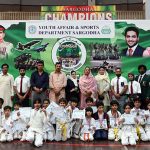 A Group photo of District Sports officer, Saima Manzoor with players during a karate competition held in connection with marking the completion of one year of the victory of Marka-e-Haq Bunyan-ul-Marsoos organized by District Sports department at Sports Gymnasium