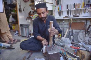 Blacksmith sharpen knives ahead of the Eid al-Adha