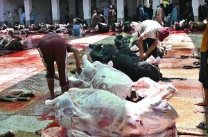 Butchers are busy slaughtering sacrificial animals at Jamia Naeemia on the 1st day of Eidul Azha