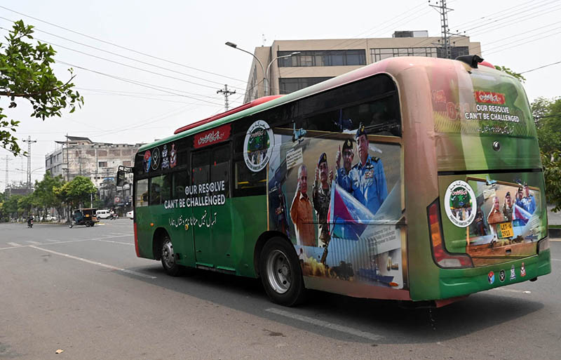 A bus is decorated with victory flexes to express solidarity with the Pakistan Army on the occasion of the Marka-e-Haq victory anniversary
