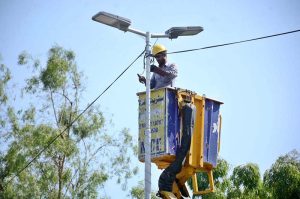 A TMA electrician repairs streetlights on Sargodha Road to ensure smooth traffic flow and public convenience during nighttime hours.