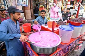 Vendors selling traditional summer drink at Pakistan Chowk during scorching hot weather in the City.