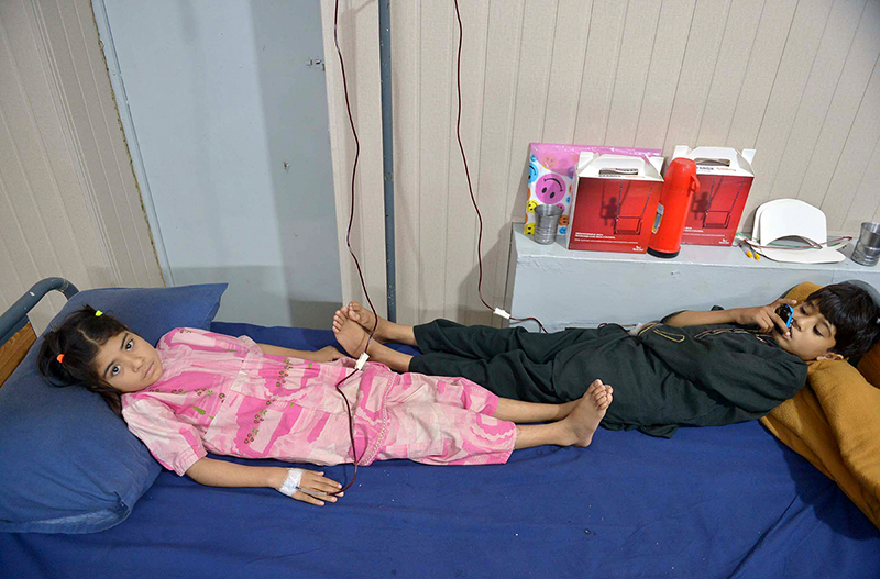 Young thalassemia patients receive a blood transfusion at a Hamza Foundation medical center on the eve of World Thalassemia Day