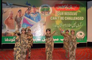 Students perform a tableau marking the completion of one year of the victory of Marka-e-Haq Bunyan-ul-Marsoos at Arts Council