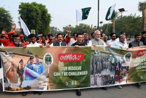A bus is decorated with victory flexes to express solidarity with the Pakistan Army on the occasion of the Marka-e-Haq victory anniversary