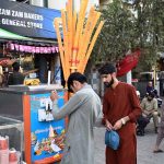 Vendor display and sell cone ice-cream to attract customers on a hot day in the city at Stadium Road