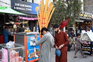 Vendor display and sell cone ice-cream to attract customers on a hot day in the city at Stadium Road
