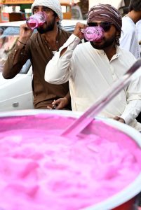 Vendors selling traditional summer drink at Pakistan Chowk during scorching hot weather in the City.