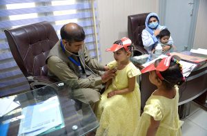 Young thalassemia patients receive a blood transfusion at a Hamza Foundation medical center on the eve of World Thalassemia Day