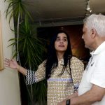 Visitors view an art display by artists at an exhibition held at the Shakir Ali Museum