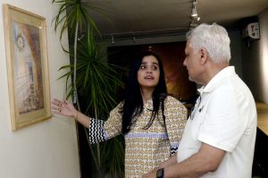 Visitors view an art display by artists at an exhibition held at the Shakir Ali Museum
