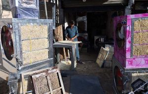 Vendor display and sell cone ice-cream to attract customers on a hot day in the city at Stadium Road