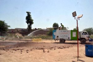 Livestock staff are spraying animals with antiseptic in the cattle market at Jhang Road to maintain hygiene and prevent diseases ahead of Eid-ul-Adha