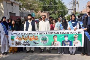 Syed Ali Qasim Gilani leads a solidarity walk with students and faculty members of The Women University Multan during a ceremony organized to commemorate Marka-e-Haq to express support to the Pakistan Armed Forces.