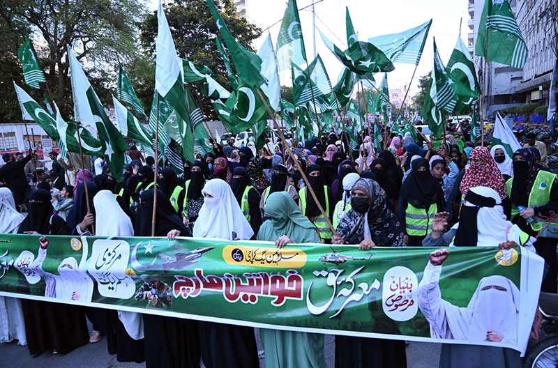 Women activists of the Central Muslim League hold a Women March rally to commemorate one year of Marka-e-Haq at the Karachi Press Club