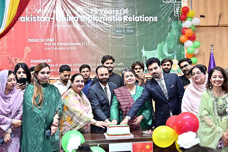 President Faisalabad Chamber of Commerce & Industry (FCCI) Farooq Yousaf Sheikh with Prof. Dr. Kanwal Ameen. Vice Chancellor GCWUF cutting cake during commemorating 75 years of Pakistan-China Diplomatic Relations arranged by Government College Women University Faisalabad (GCWUF) at Jinnah Auditorium