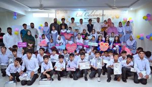 Secretary Social Welfare Sharif Hussain and Chief Child Commission Ijaz Khan along with other officials distributing Eid gifts among the children of Zamung Kor Institute and Special Education Complex.