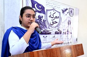 A student speaks during celebrating 1st anniversary of Marka-e-Haq (Battle of Truth) at Begum Nusrat Bhutto Government Girls Degree College