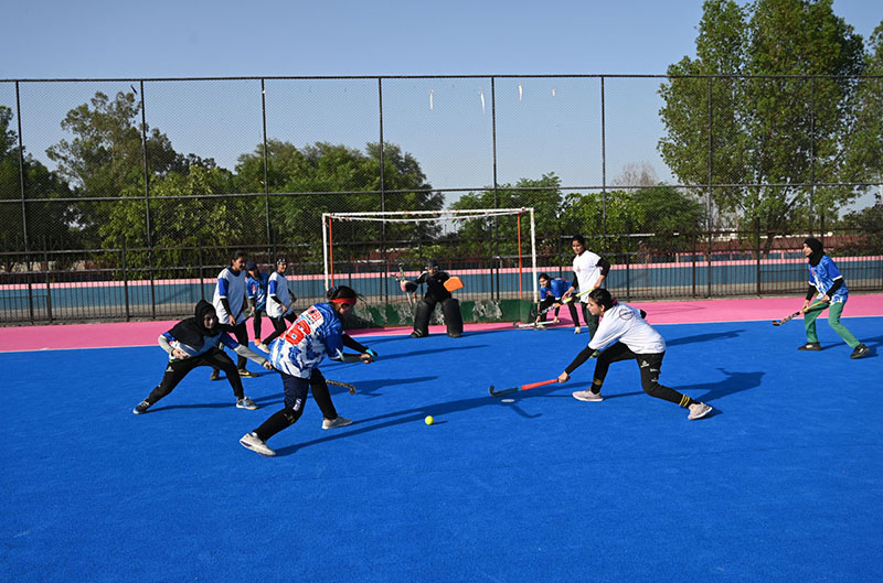 Players in action during a friendly hockey match between the Color and White teams of Fatima Women's Hockey Academy held at the Struff Hockey Stadium in connection with Marka-e-Haq