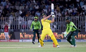 Australia’s Nathan Ellis plays a shot during the first One Day International cricket match between Pakistan and Australia at the Rawalpindi Cricket Stadium
