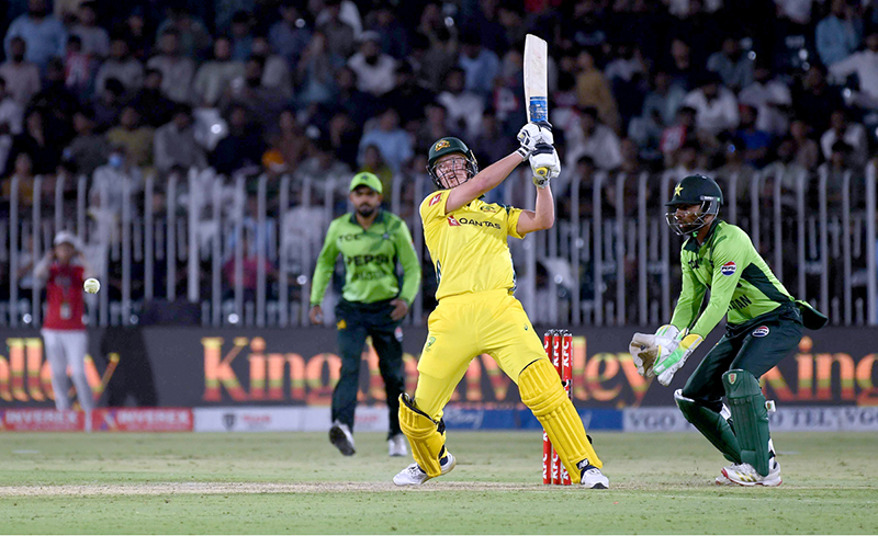 Australia’s Nathan Ellis plays a shot during the first One Day International cricket match between Pakistan and Australia at the Rawalpindi Cricket Stadium