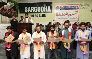 Chairman Interfaith Peace Committee District Sargodha Amjid Mahmood Bhatti takes oath during a ceremony of the Electronic Media Cameramen Association at Sargodha Press Club