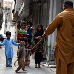 A juggler with his pet monkey showing tricks to earn for livelihood in the Provincial Capital