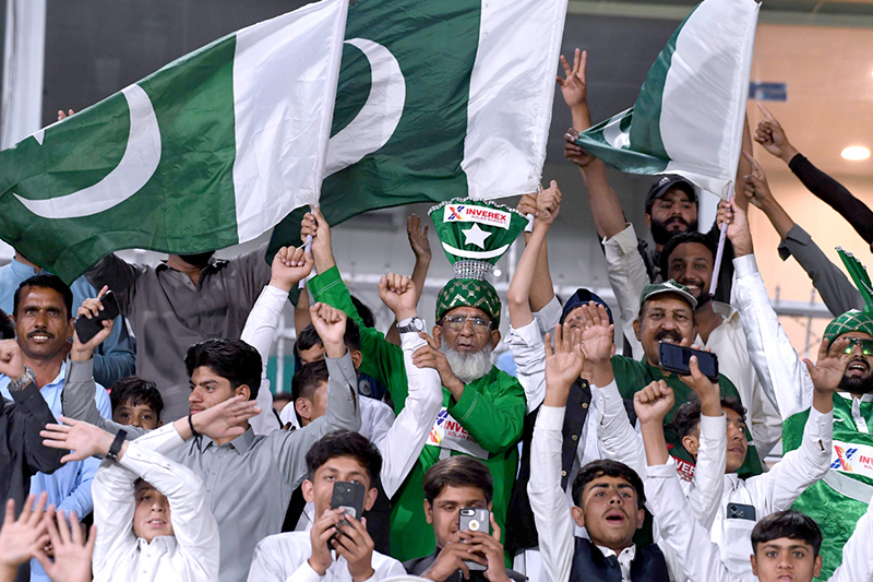 A large number of spectators enjoy the first One Day International cricket match between Pakistan and Australia at the Rawalpindi Cricket Stadium