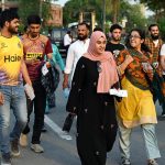 Spectators arrive in the stadium during the Pakistan Super League (PSL) final match between Hyderabad Kingsmen and Peshawar Zalmi at Gaddafi Stadium