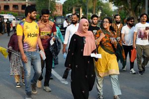 Spectators arrive in the stadium during the Pakistan Super League (PSL) final match between Hyderabad Kingsmen and Peshawar Zalmi at Gaddafi Stadium