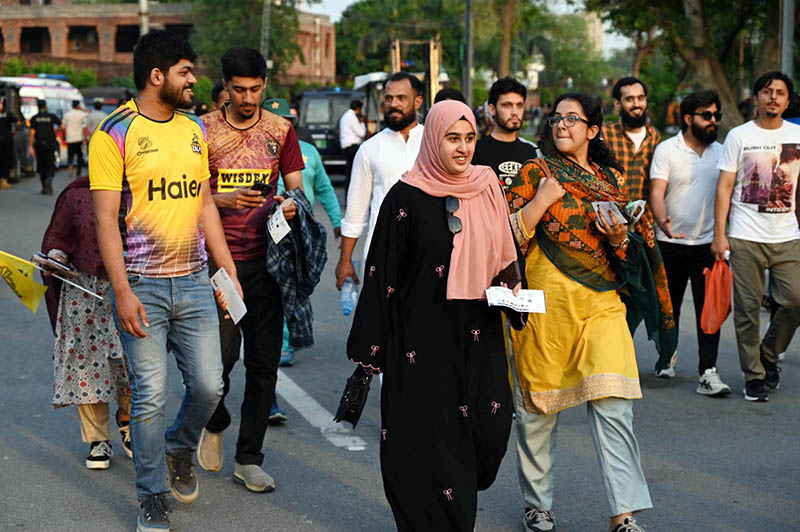 Spectators arrive in the stadium during the Pakistan Super League (PSL) final match between Hyderabad Kingsmen and Peshawar Zalmi at Gaddafi Stadium